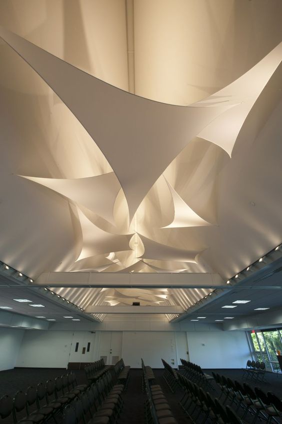 Image: Suspended stretch fabric ceiling design in an office.